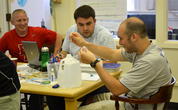 Teachers in Project NEURON work on hands-on project.